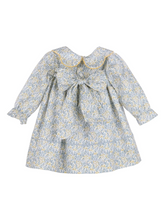 Load image into Gallery viewer, Timeless elegance meets playful charm in this Girls Blue Snowberry Float Dress from Sophie &amp; Lucas. The signature scalloped collar frames a stunning blue and golden yellow floral print, creating a sophisticated silhouette perfect for fall gatherings, holiday celebrations, and cherished photo moments. A classic piece designed to transition seamlessly through the season while maintaining that polished, editorial aesthetic your collection is known for.
