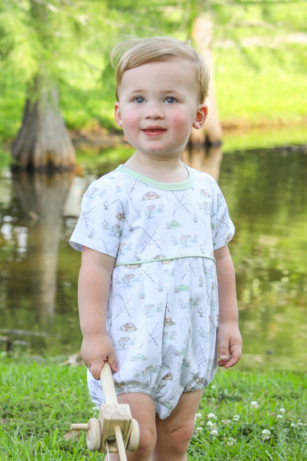 Introduce your little one to the joys of fishing with the Infant Boy's Gone Fishing Bubble from Trotter Street Kids! This classic white and green bubble is adorned with a charming fishing print, perfect for any fishing enthusiast. Add a touch of class to your baby's wardrobe and inspire a love for the great outdoors.