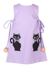Load image into Gallery viewer, The Emma Jumper Black Cats from The Yellow Lamb is a charming lavender shift dress perfect for your toddler’s Halloween celebrations. Featuring playful black cat appliques, this jumper combines festive fun with classic style, making it an ideal choice for little girls to enjoy the season in comfort and cuteness. Pairs with The Yellow Lamb matching Lavender Leggings so she can wear this as a dress or a set on cooler days!

