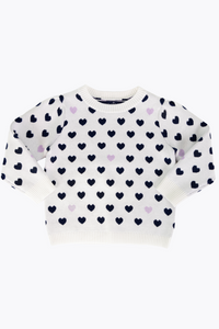Embrace cozy style this fall with the Girls Heart Sweater in Ivory. Featuring delicate navy and lilac heart patterns, this beautifully knit sweater offers warmth and charm, making it an ideal choice for any little girl's wardrobe. Its soft fabric ensures comfort all day long, while the elegant design adds a sweet, playful touch to her seasonal outfits.