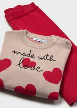 Load image into Gallery viewer, Cozy knit sweater and pants set from Mayoral featuring a playful hearts design. The soft, lightweight sweater pairs perfectly with coordinating pants for an effortless outfit that transitions from playtime to special occasions. Ideal for layering on cool fall and winter days, this two-piece set offers comfort and style in one coordinated look.
