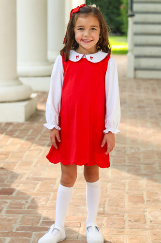 The Girls Holiday Bow Dress Set from Trotter Street Kids offers timeless festive style with a charming red dress featuring a delicate scalloped hem. Paired with a crisp white shirt adorned with a graceful bow collar, this set captures classic holiday elegance perfect for special occasions. Comfortable and eye-catching, it’s designed to make every celebration memorable.