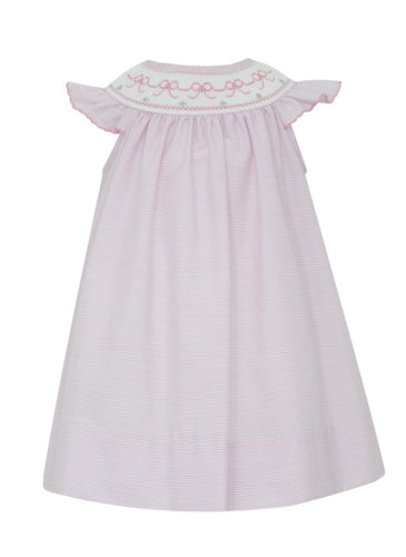 Dress your little girl in the adorable Girl's Pink Bows Bishop Dress by Petit Bebe. This cute dress features pink tiny stripes and a lovely pink bow smocking, perfect for any occasion. With its soft fabric and charming design, your little one will look and feel absolutely darling!