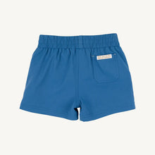 Load image into Gallery viewer, Elevate your little one's style with the Boy's Prepletic Sheffield Shorts in Wood Boat Blue by The Beaufort Bonnet Company. These versatile activewear shorts are a wardrobe staple that can be paired with any look. The vibrant blue color adds a pop of color, making them perfect for any adventure!
