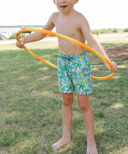 Load image into Gallery viewer, Make a splash this season with the Boys Board Short in Pagoda Gardens from Bailey Boys. Featuring a fun and vibrant Pagoda Garden print, these shorts bring playful style to any summer wardrobe. The poly-blend stretch lining ensures comfort and freedom of movement, while practical side and back pockets keep essentials within reach. Perfect for beach days, pool parties, or casual adventures.
