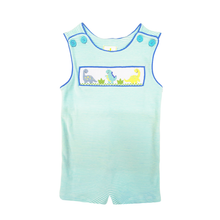 Load image into Gallery viewer, Dress your little adventurer in the Dino Shortall in Mint Stripe by Zuccini Kids! This charming piece features a delightful mint knit stripe adorned with playful dinosaur smocking. Crafted from soft, breathable material, it ensures comfort during all their explorations. Let their imagination run wild!

 
