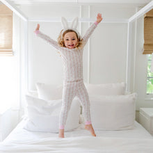 Load image into Gallery viewer, Give your little one the gift of comfort and joy with the Grayson Girls’ Pajama Pant Set in Easter Bunnies Pink by Lila and Hayes! Crafted from soft Pima cotton, this long sleeve set features an adorable Easter bunnies print, making bedtime an enchanting adventure. Let their dreams hop into a world of fun!

