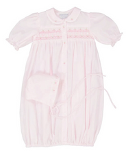 Load image into Gallery viewer, Welcome your little one in style with the Pink Ribbon Smocked Take Me Home Gown With Bonnet by Feltman Brothers. This timeless gown, adorned with classic smocking and charming buttons, creates a perfect backdrop for precious newborn photos. The included bonnet completes this adorable look, ensuring your baby shines on their journey home!
