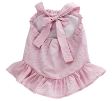 Load image into Gallery viewer, Experience the joyful spirit of summer with the Cherry Jubilee Bathing Suit by Bailey Boys! This delightful pink seersucker design, adorned with charming cherries, ensures your little one stands out at the beach or pool. The precious drop hem ruffle and halter tie neck add a touch of playful elegance, making every splash a memorable moment!
