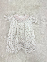 Load image into Gallery viewer, Introduce your little one to comfort and charm with the Bella Pink Floral Pima Hand Smocked Bubble by Baby Loren. Crafted from ultra-soft Pima cotton, this delightful bubble features a beautiful pink and blue floral pattern, adorned with hand smocking for an extra touch of elegance. It’s the perfect gift that combines style and comfort for your baby girl!

 

