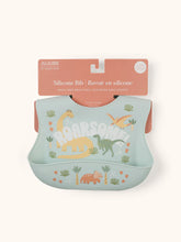 Load image into Gallery viewer, Keep your baby’s clothes clean and dry during feeding time with a nontoxic, food-grade Silicone Bib from JuJuBe × Studio Oh! Made for babies 4 months and older, these bibs feature a deep front pocket to catch messes, and because they are dishwasher-safe, cleanup is fast and easy! Designed to fit comfortably and stay put, each bib features four ouch-free fasteners at the back of the neck strap, so it will stay comfortable as your baby grows.
