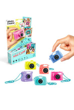 Load image into Gallery viewer, The Photo Creator Mini Camera gives kids a real photo and video experience in a tiny, easy-to-use design made just for them. Small enough to clip onto a backpack, this kid-friendly camera lets young creators capture everyday moments while exploring creativity on the go. It feels like real tech, but plays like a toy.

