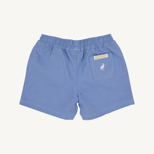 Load image into Gallery viewer, Introducing the Sheffield Shorts in Park City Periwinkle by The Beaufort Bonnet Company, a delightful addition to your boy's wardrobe. The soft periwinkle hue is perfect for sunny days, while the charming white stork detail adds a touch of whimsy. These shorts are not just stylish; they are a must-have for comfort and fun adventures!
