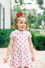 Load image into Gallery viewer, The Apple Blossoms Dress by The Proper Peony is a delightful blend of charm and comfort. Made from soft Pima cotton, it features a whimsical apple and bow print, along with an adorable Peter Pan collar. Perfect for the first day of school, this dress combines style and ease, ensuring your little one feels confident and cute!
