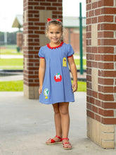 Load image into Gallery viewer, Celebrate every school moment in the vibrant royal blue School Appliqué Dress by Trotter Street Kids. Delightful school-themed appliqués bring joy and imagination to your toddler’s wardrobe, making each day feel special and full of adventure!
