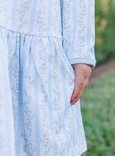 Load image into Gallery viewer, Let your little one twirl with joy in the Vineyard Blooms Dress by Trotter Street Kids. Soft pastels and delicate florals blend with a charming ruffled collar and pockets, creating a dress that’s as playful and sweet as childhood itself. Ready for every autumn adventure!
