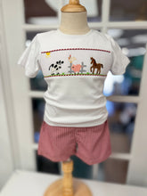 Load image into Gallery viewer, Petit Ami’s Farm Smocked Short Set brings autumn to life with a soft white tee featuring charming farm animal smocking and vibrant red gingham shorts. This joyful ensemble captures the warmth and spirit of harvest season, making every moment outdoors feel magical and bright!

 
