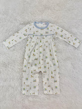 Load image into Gallery viewer, Baby Loren’s Baby Toys Pima Romper wraps your little one in soft, breathable comfort with charming baby toy prints and delicate blue piping. This timeless, playful design makes every moment joyful and is the perfect gift to celebrate your infant boy’s early days!

 
