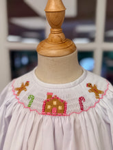 Load image into Gallery viewer, Cape Point Clothing Co.’s Gingerbread Cottage Bishop Pant Set delights with a charming white blouse accented in pink ruffles and whimsical gingerbread cottage smocking. Paired with cozy pink corduroy pants featuring ruffled hems, it keeps your toddler warm and radiant throughout the magical Christmas season!
