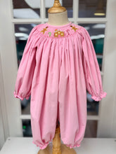 Load image into Gallery viewer, Cape Point Clothing Co.’s Gingerbread Cottage Long Bubble wraps your little one in soft pink corduroy, accented with charming ruffled sleeves and delicate gingerbread cottage smocking. This festive piece brings warmth and whimsy to your infant’s holiday moments with irresistible style and comfort!
