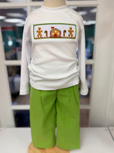 Load image into Gallery viewer, Celebrate the magic of Christmas with the Gingerbread Cottage Boy Pant Set by Cape Point Clothing Co. This charming set pairs a soft white knit tee adorned with cozy gingerbread cottage smocking and rich green corduroy pants—designed to keep your toddler boy comfortable and festive all season long!
