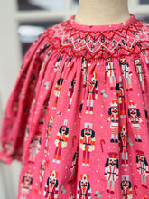 Load image into Gallery viewer, Celebrate the season with Cape Point Clothing Co.’s Nutcracker Bishop Pant Set! A charming pink nutcracker blouse paired with cozy pink corduroy pants wraps your toddler in warmth and festive joy, making chilly days feel magical and stylish. Perfect for creating unforgettable holiday memories.

