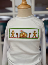 Load image into Gallery viewer, Celebrate the magic of Christmas with the Gingerbread Cottage Boy Pant Set by Cape Point Clothing Co. This charming set pairs a soft white knit tee adorned with cozy gingerbread cottage smocking and rich green corduroy pants—designed to keep your toddler boy comfortable and festive all season long!
