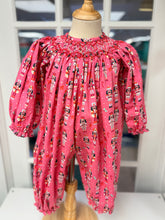 Load image into Gallery viewer, Cape Point Clothing Co.’s Nutcracker Bishop Bubble enchants with festive nutcracker prints and delicate white and red smocking, wrapping your infant girl in warmth and holiday spirit. Perfect for chilly Christmas days, this charming outfit blends comfort with timeless celebration.
