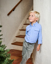 Load image into Gallery viewer, Built for the boat, ready for just about anything. Finn’s Backcast Button Down is a breathable, UPF 50 fishing shirt with a vented back to keep him cool and comfortable all day long. Roll-up sleeves with button tabs and dual chest pockets add practical utility, while the collared design makes it an easy choice for casual dinners or weekend outings after a day on the water. 
