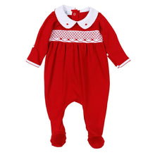 Load image into Gallery viewer, Wrap baby in the warmth and wonder of the season with the Millie Smocked Footie, a timeless piece made for holiday magic by Magnolia Baby. Dressed in a rich, festive red, this one-piece captures the spirit of Christmas with its delicate hand-smocked detailing and embroidered rosebuds, creating a look that feels both classic and heirloom-worthy.


