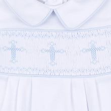 Load image into Gallery viewer, Elegant and meaningful, the Forever Blessed Smocked Gown is a beautiful choice for celebrating your baby’s most special moments. Designed with a classic hand-smocked panel across the chest, it features delicate light blue embroidered crosses for a soft, faith-inspired touch.
