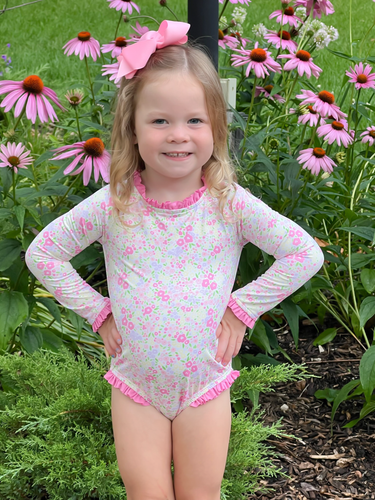 The Leighton One Piece Rash Guard Swim in Fuchsia Floral is perfect for infant and toddler girls. It features an adorable floral print, pink ruffle details, and a beautiful pink back tie. Keep your little one protected from the sun and looking cute at the same time.