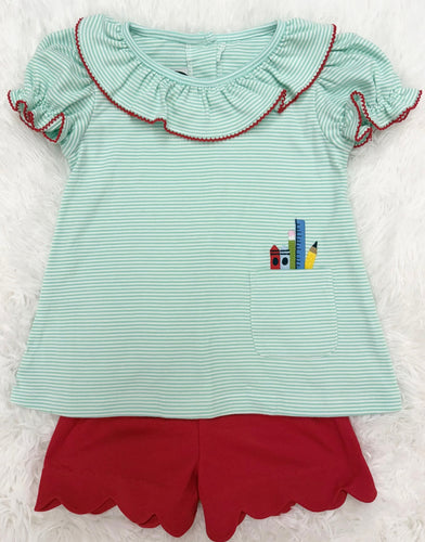 Dress your little one in playful charm with the Girls School Supplies Short Set from Cape Point Clothing. This delightful outfit features a ruffle collar and embroidered school supplies that add a whimsical touch. The mini mint and white striped top pairs perfectly with coordinating red scallop hem shorts, while a convenient front pocket combines style with practicality. Ideal for school days or casual outings, this set offers both comfort and cuteness in one irresistible package.