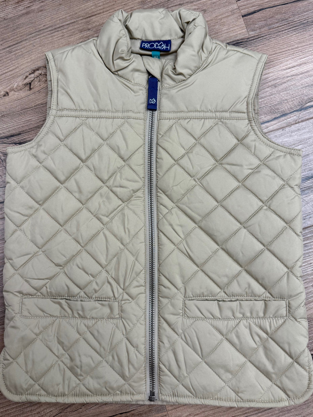 This Boys Quilted Vest from Prodoh offers a sleek, quilted design that adds warmth without the bulk. Perfect for layering over pullovers and polos, it creates a sharp, stylish look ideal for fall days. Comfortable and versatile, this vest ensures your little one stays cozy while looking effortlessly put together.