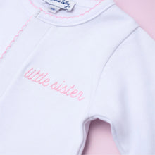 Load image into Gallery viewer, Celebrate the special bond between siblings with Magnolia Baby’s Little Sister Embroidered Footie! Crafted from luxurious Peruvian Pima cotton, this footie offers unparalleled softness and comfort for your little one. The design features an embroidered "little sister" in a gentle pink, highlighting her special role.
