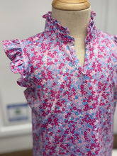 Load image into Gallery viewer, Elevate your tween's wardrobe with the Ellie Preppy Petals Sleeveless Top! This vibrant floral tee combines comfort with playful style, perfect for active spring and summer days. Let her express her personality and embrace the warmth of the season in this lively and chic piece!
