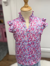 Load image into Gallery viewer, Elevate your tween's wardrobe with the Ellie Preppy Petals Sleeveless Top! This vibrant floral tee combines comfort with playful style, perfect for active spring and summer days. Let her express her personality and embrace the warmth of the season in this lively and chic piece!
