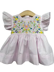 Get ready for Spring with our Hallie Embroidered Diaper Set for infant girls! This delicate dress and diaper cover from Shop Teeta features pink and white stripes, ruffle shoulders, and beautiful embroidered flowers. Perfect for your little one to stand out at any Spring event! Also available in a Toddler Dress!