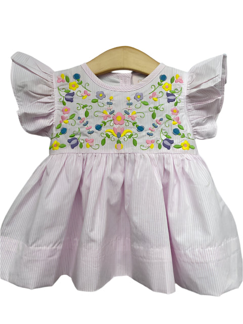 Get ready for Spring with our Hallie Embroidered Diaper Set for infant girls! This delicate dress and diaper cover from Shop Teeta features pink and white stripes, ruffle shoulders, and beautiful embroidered flowers. Perfect for your little one to stand out at any Spring event! Also available in a Toddler Dress!