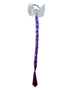 Elevate your daughter's style with the Fantasy Braided Ponytail Extension from Anuja Tulia! This playful and colorful ponytail comes with three different styles and colors, complete with a charming detail of either a butterfly, unicorn, or rainbow. Not only is it a fashion statement, but it also supports a great cause, with proceeds going to charity.