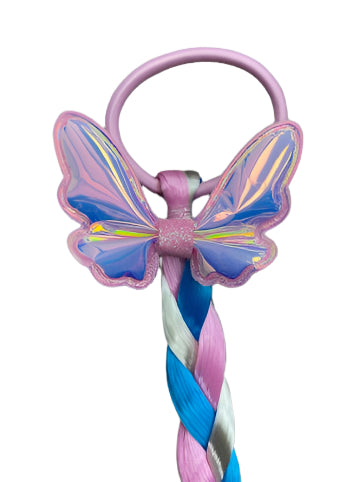 Elevate your daughter's style with the Fantasy Braided Ponytail Extension from Anuja Tulia! This playful and colorful ponytail comes with three different styles and colors, complete with a charming detail of either a butterfly, unicorn, or rainbow. Not only is it a fashion statement, but it also supports a great cause, with proceeds going to charity.