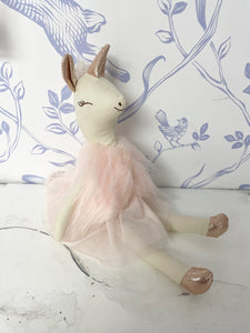 Evie The Unicorn from Great Pretenders is a handcrafted doll, embellished with soft glitter tulle, metallic knits, yarn detailing and fanciful expressions / embroidered details. These soft-bodied dolls are perfect for keeping secrets, confiding wishes in, and becoming friends with little ones of all ages. Collectable and Timeless! Approx. 12".