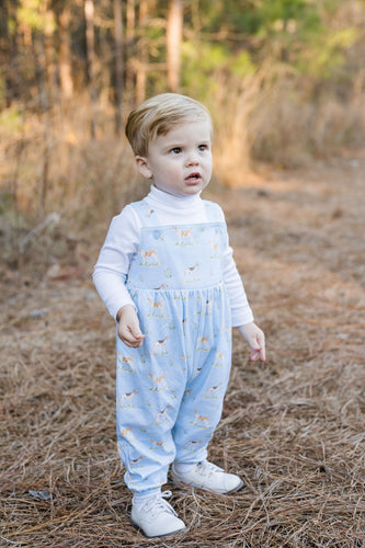 This Puppy Dog Tails James Longall from James & Lottie offers a charming and cozy outfit for your little one. Featuring a light blue knit with an adorable hunting pointer dog design, this longall blends classic style with all-day comfort. Perfect for everyday play or special occasions, it keeps your child looking cute and feeling snug.