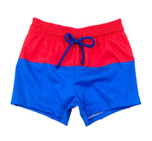 Load image into Gallery viewer, Celebrate your little one&#39;s love for their country with Boy&#39;s Patriotic James Swim Shorts from James &amp; Lottie. These classic blue and red block design swim shorts are perfect for showing off their patriotism in style this summer. Get ready for some fun in the sun with this stylish swimsuit!
