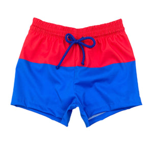 Celebrate your little one's love for their country with Boy's Patriotic James Swim Shorts from James &amp; Lottie. These classic blue and red block design swim shorts are perfect for showing off their patriotism in style this summer. Get ready for some fun in the sun with this stylish swimsuit!