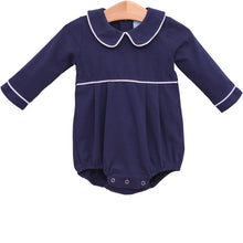 Load image into Gallery viewer, Dress your little one in timeless charm with the Joseph Bubble in Navy from Trotter Street. This classic navy bubble features a delicate Peter Pan collar and crisp white piping, adding a touch of elegance to your infant boy’s wardrobe. Personalize it with a name or monogram to create a cherished heirloom that will be treasured for years to come. Perfect for special occasions or everyday wear, this piece combines style and sentiment beautifully.
