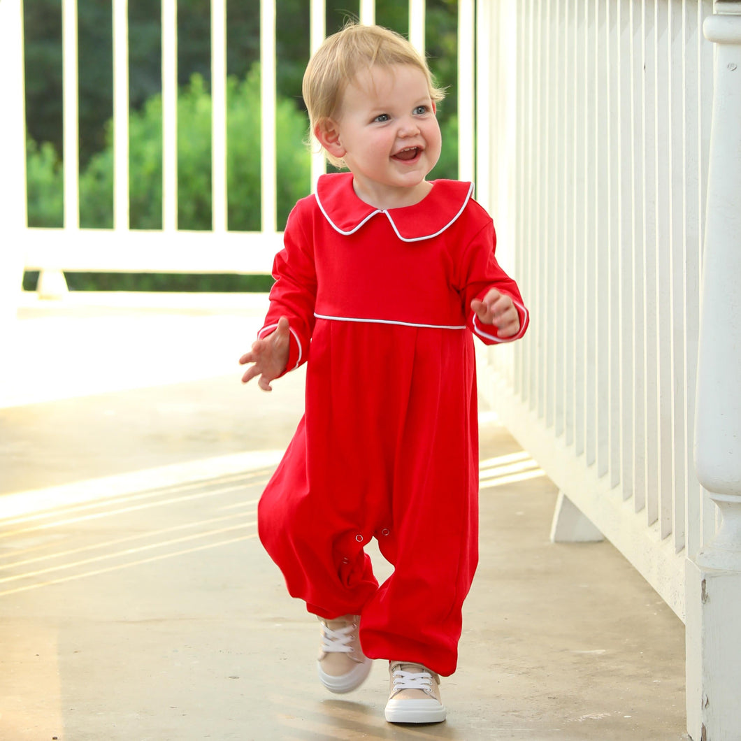 Dress your little one in timeless charm with the Joseph Bubble in Red from Trotter Street. This classic red bubble features a delicate Peter Pan collar and crisp white piping, adding a touch of elegance to your infant boy’s wardrobe. Personalize it with a name or monogram to create a cherished heirloom that will be treasured for years to come. Perfect for special occasions or everyday wear, this piece combines style and sentiment beautifully.