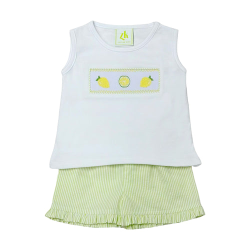 Get your little one ready for summer with the Lemon Blair Smocked Short Set from Zuccini Kids! This adorable set features a knit top with smocked lemon details for a touch of sweetness. The coordinating lime green and white seersucker ruffle edge shorts add a pop of color and summer vibes.!