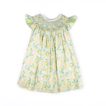Load image into Gallery viewer, Brighten her wardrobe with the Girls Smocked Lemons Kate Dress from Shop Teeta. This charming dress features a delicate smocked neckline and a vibrant lemon print that captures playful summer style. The classic silhouette offers comfortable, easy movement—perfect for active little ones. Soft and versatile, it pairs beautifully with basics for everyday wear or dressed up for special occasions. A timeless addition to any girl's closet.
