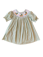 Load image into Gallery viewer, Dress your little one in timeless charm with the Smocked Bishop Kate Mallard Dress by Shop Teeta. Featuring a classic green and white gingham check, this dress is adorned with delicate smocking at the neckline and detailed embroidered mallard ducks, adding a sweet and playful touch. Perfect for coordinated family moments, it also pairs beautifully with matching sibling styles. This piece combines traditional design with exceptional craftsmanship, making it an irresistible choice for any special occasion or 
